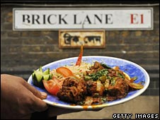 Curry under street sign for Brick Lane