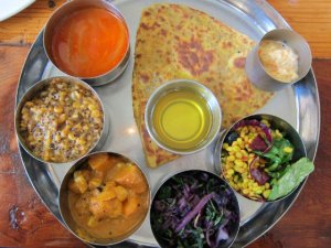 The thali - Asia's form of a sampler platter - is an excellent option to try a few products simultaneously, much like using Yogi thali seen here from Pondicheri.